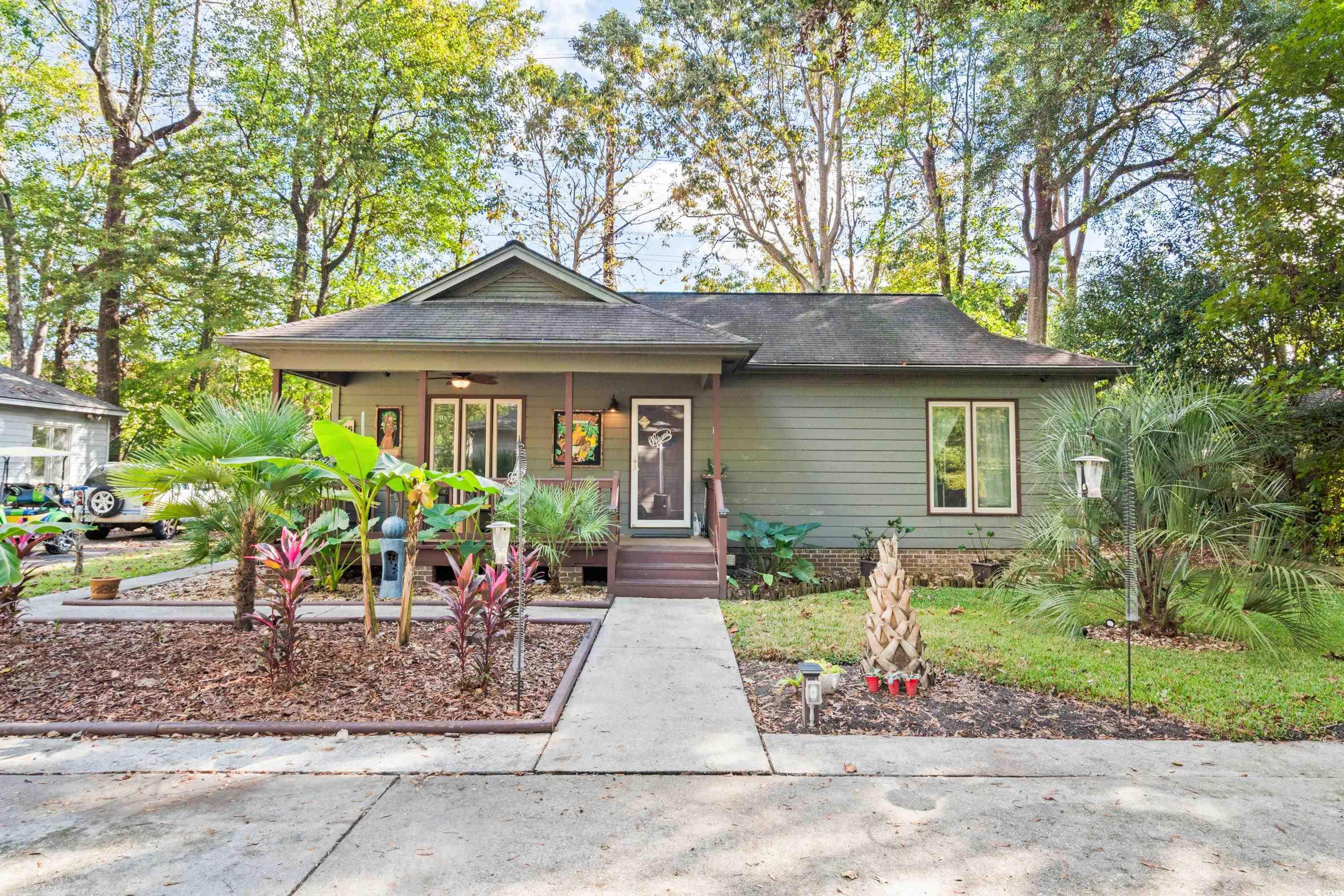 View of front of house featuring covered porch