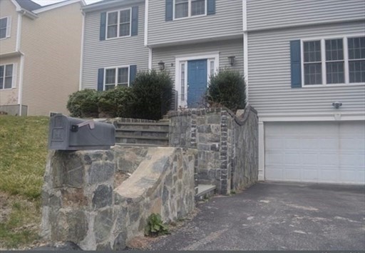 a front view of a house with brick walls