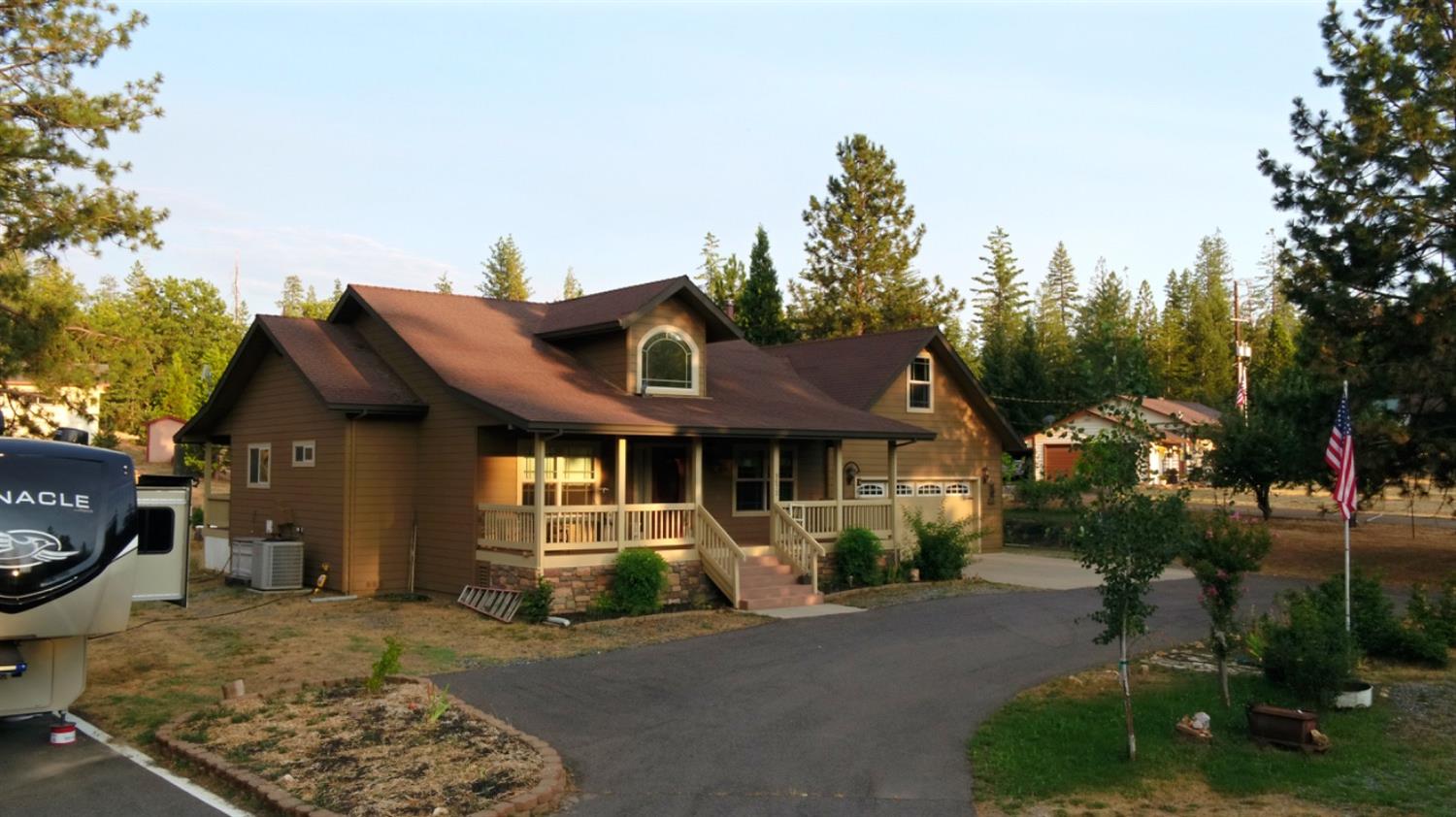 a front view of a house with garden