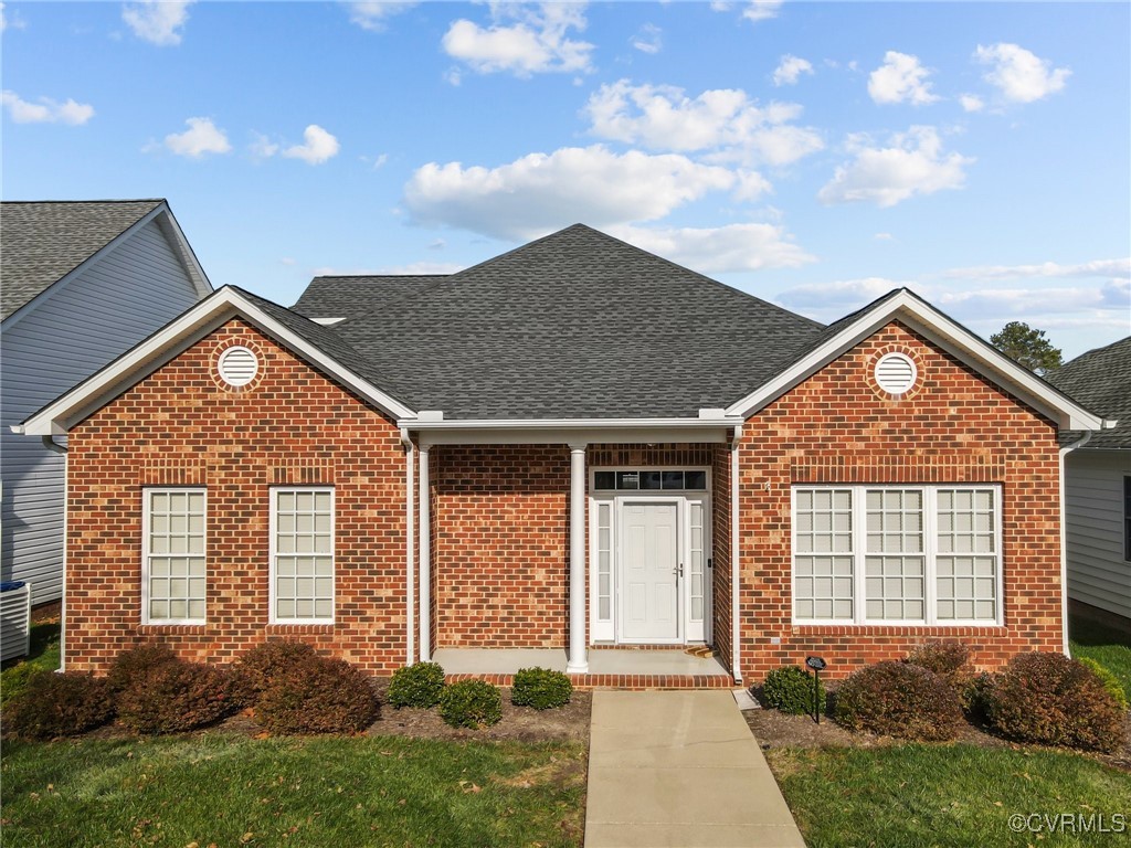 front view of a house with a yard