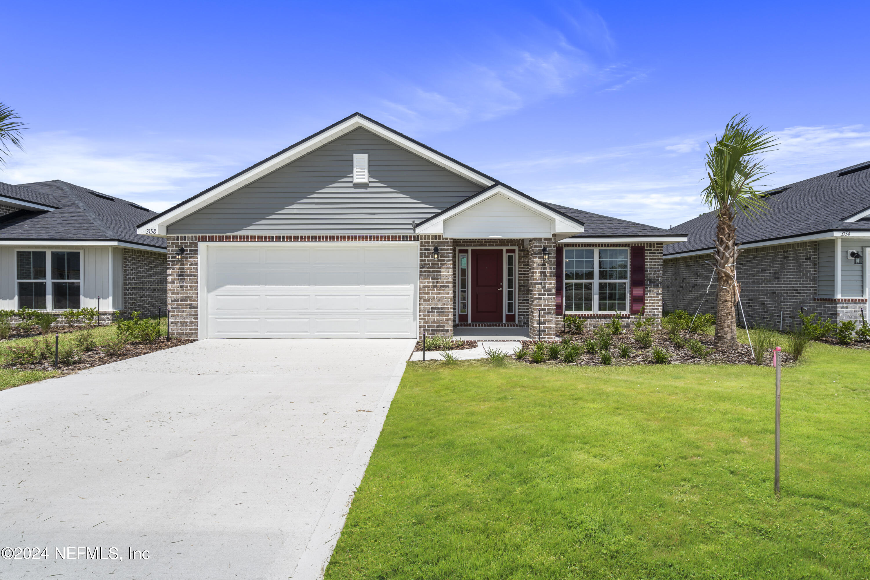 a front view of a house with a yard