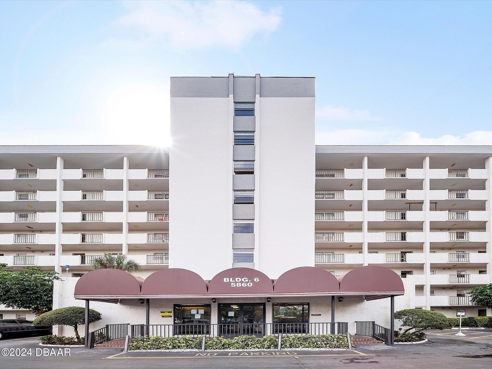 a front view of a building with street view