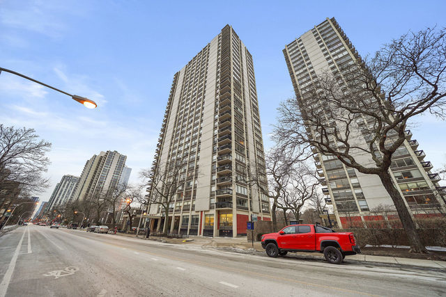 a view of a city street lined with tall buildings