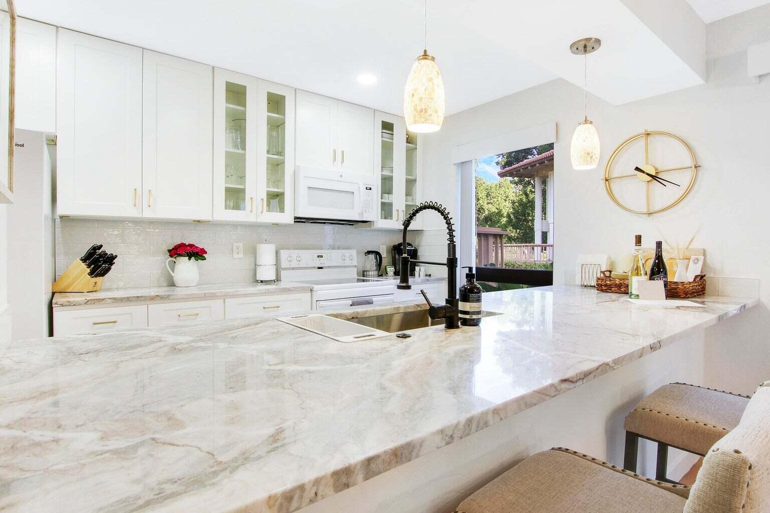 a kitchen with stainless steel appliances a sink and cabinets