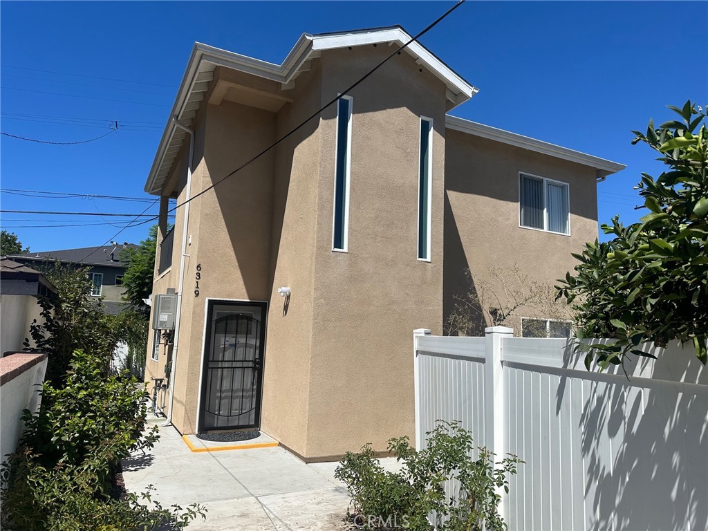 a front view of a house with garage