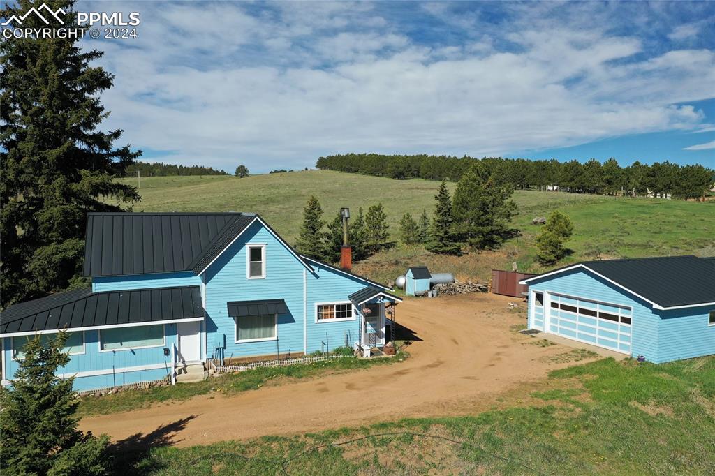 an aerial view of house with yard