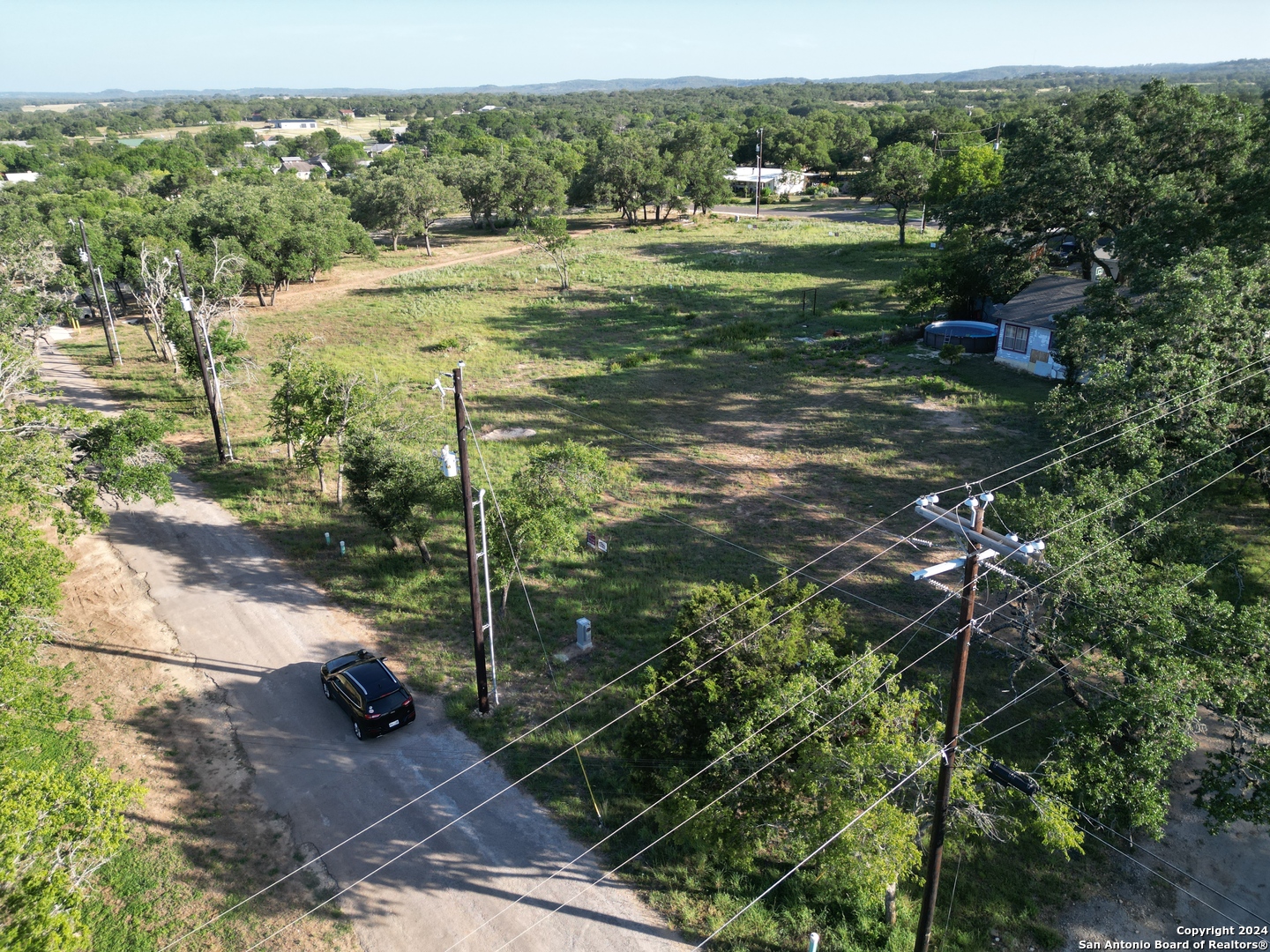 a view of a trees with a yard