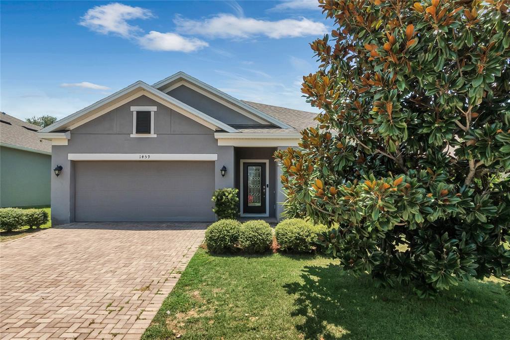 a front view of a house with a yard