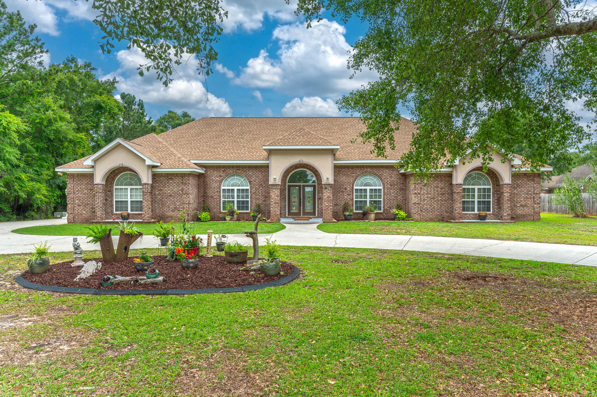 a front view of a house with garden