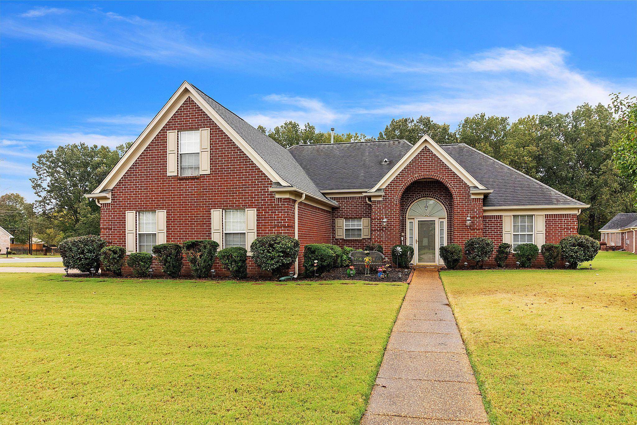 Front facade featuring a front lawn