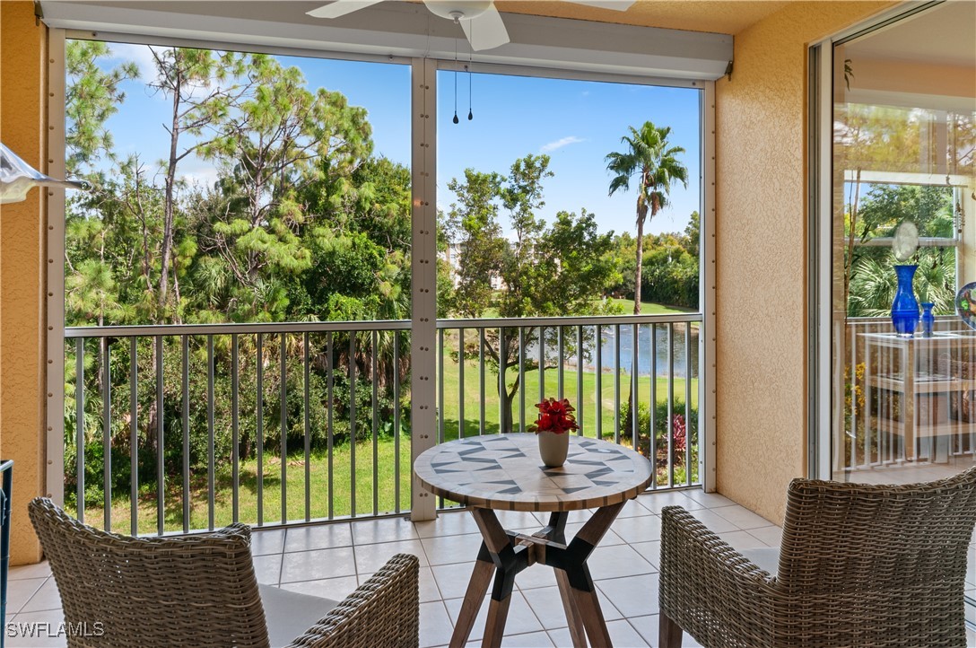 a view of a balcony with table and chairs