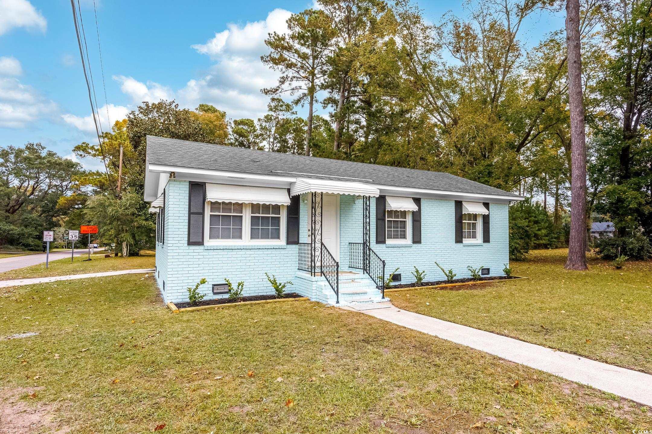 View of front of property with a front lawn