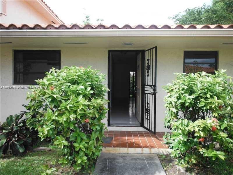 front view of a house with a small yard