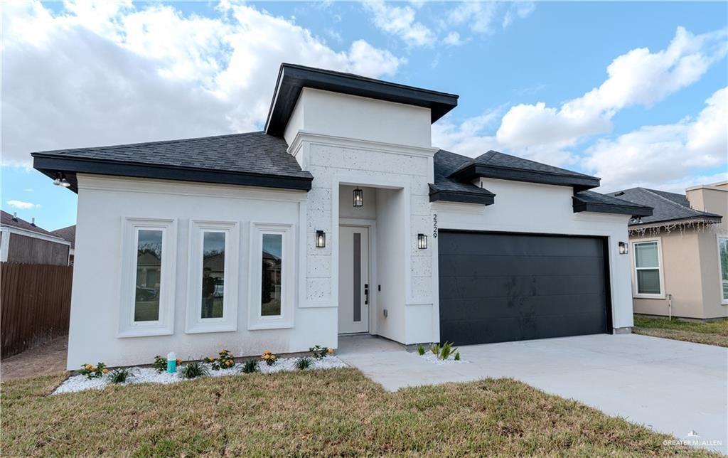 a house with yard in front of it