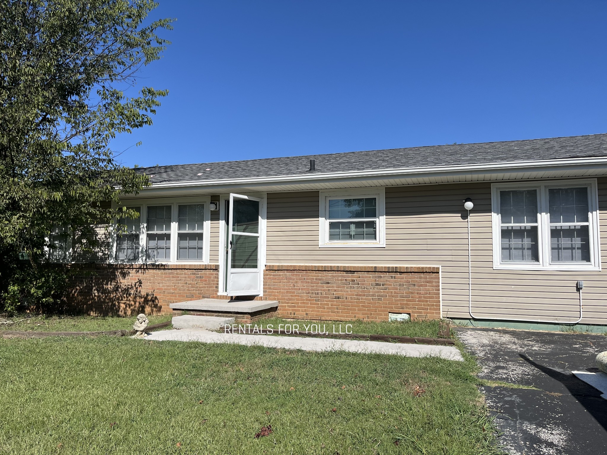 front view of a house with a yard