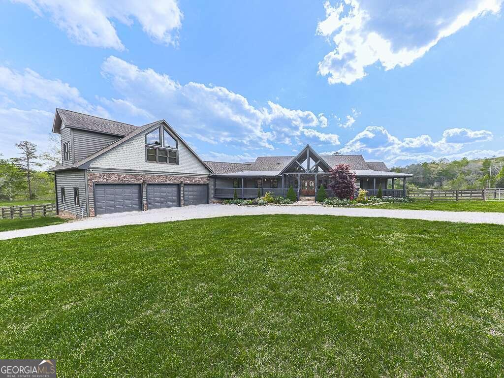 a view of a house with a big yard