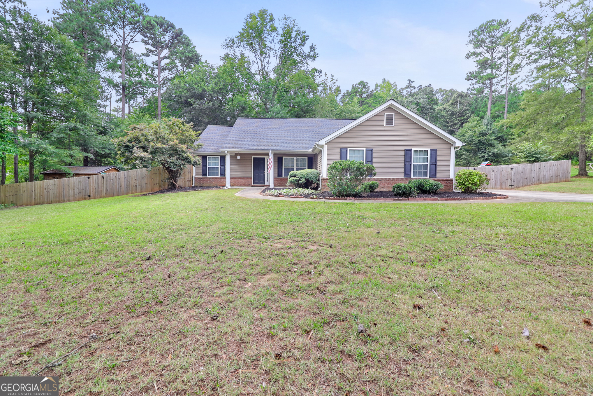 a front view of a house with yard