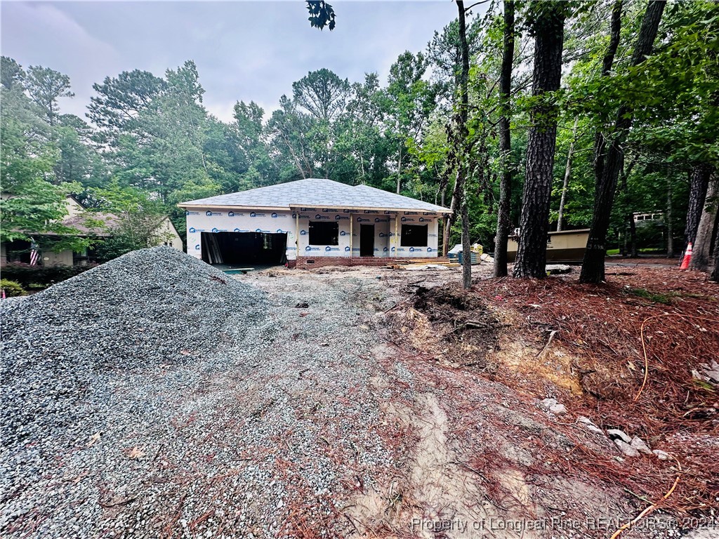 a view of house with backyard and entertaining space