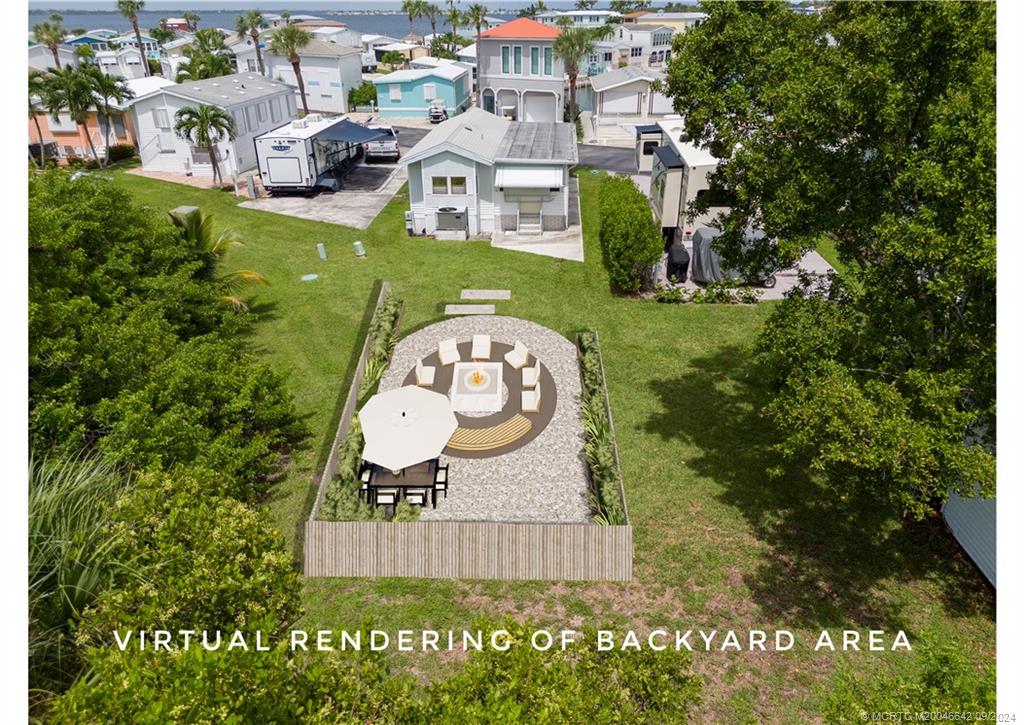 an aerial view of a house with a garden and swimming pool