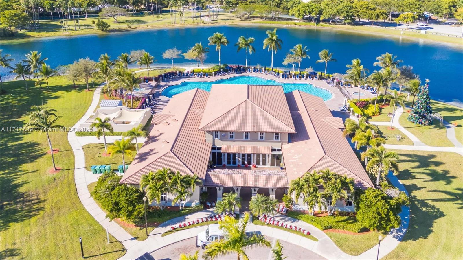 an aerial view of a house with a swimming pool