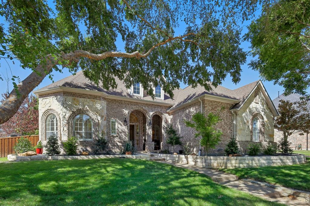 front view of a house with a garden