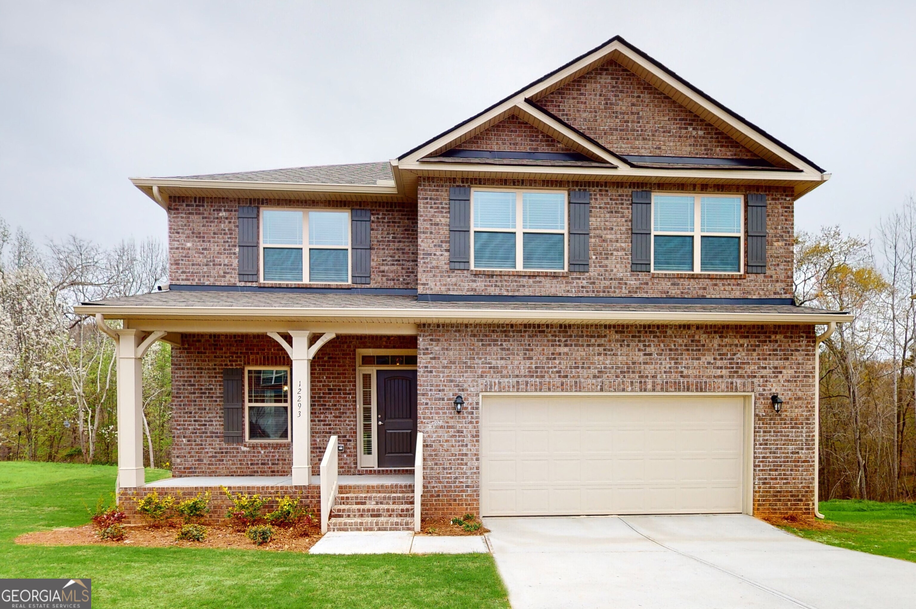 front view of a house with a yard