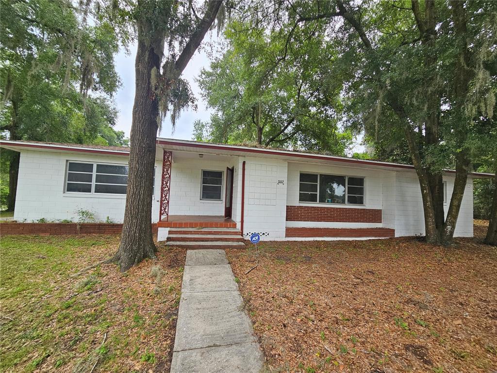 front view of a house with a yard