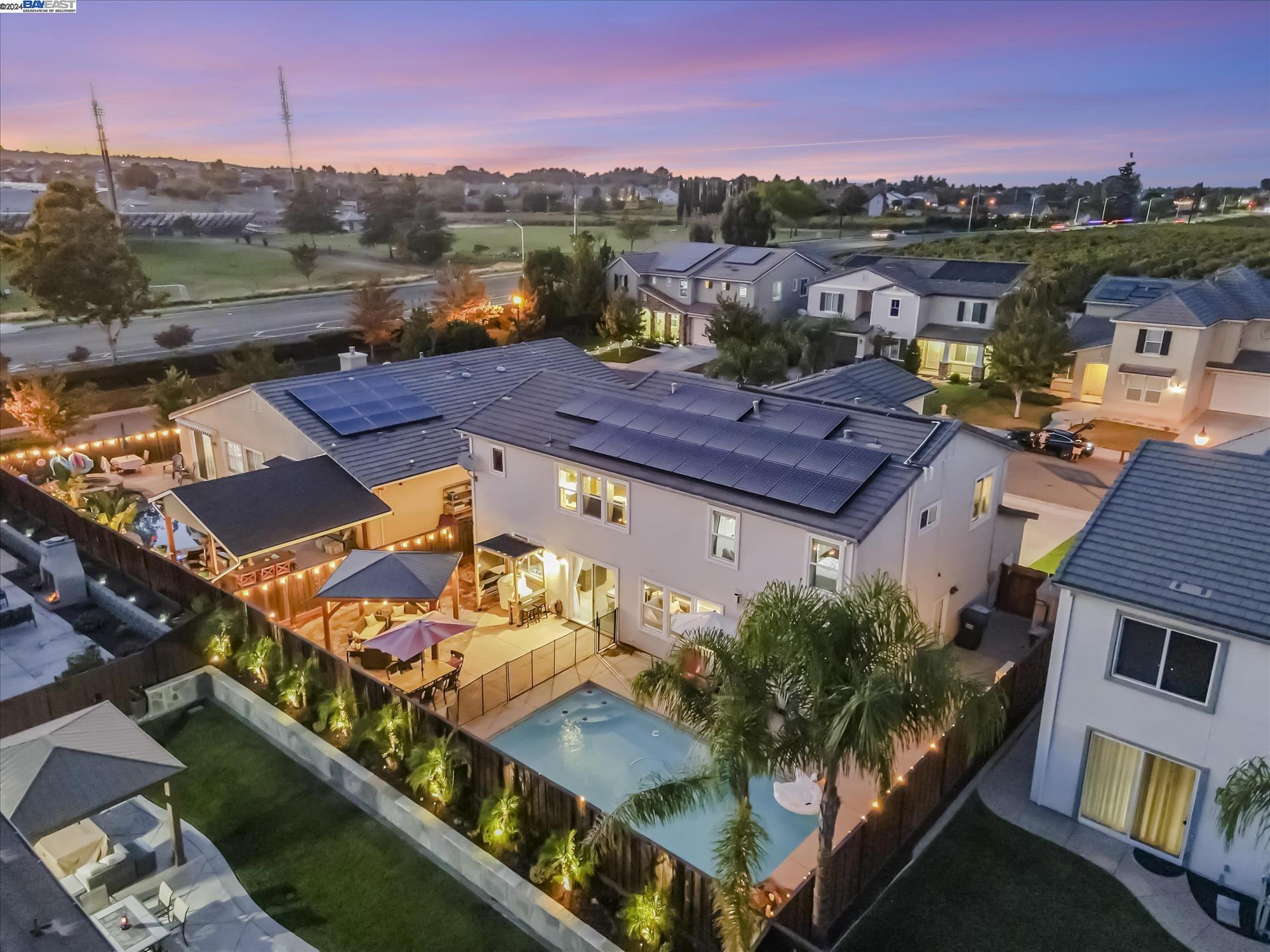 an aerial view of a house with a ocean view