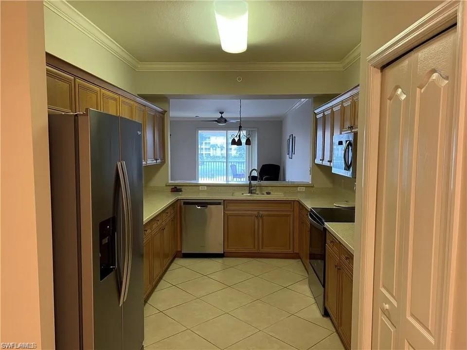 a kitchen with a refrigerator and a sink