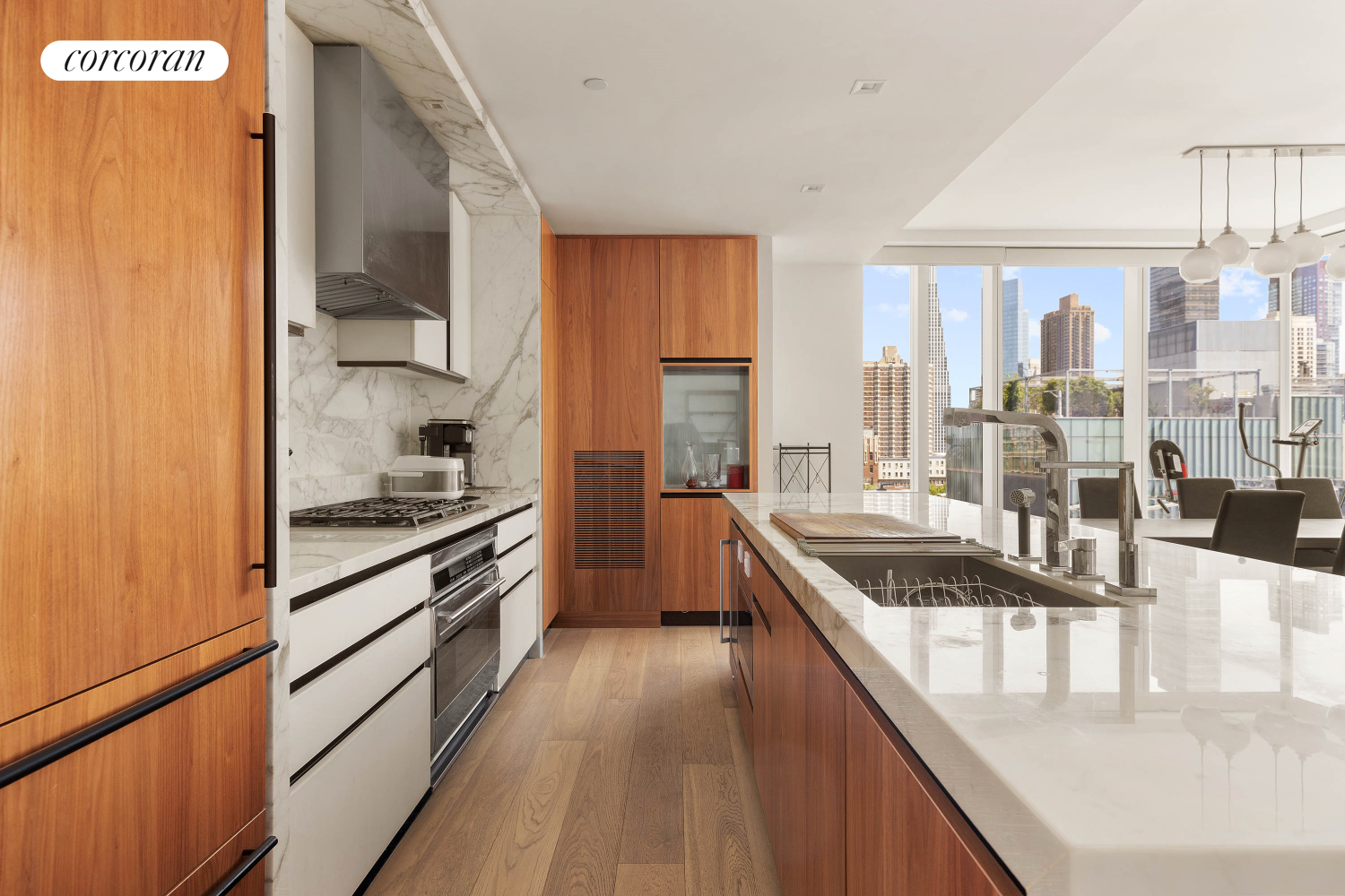 a kitchen with stainless steel appliances granite countertop sink stove and refrigerator