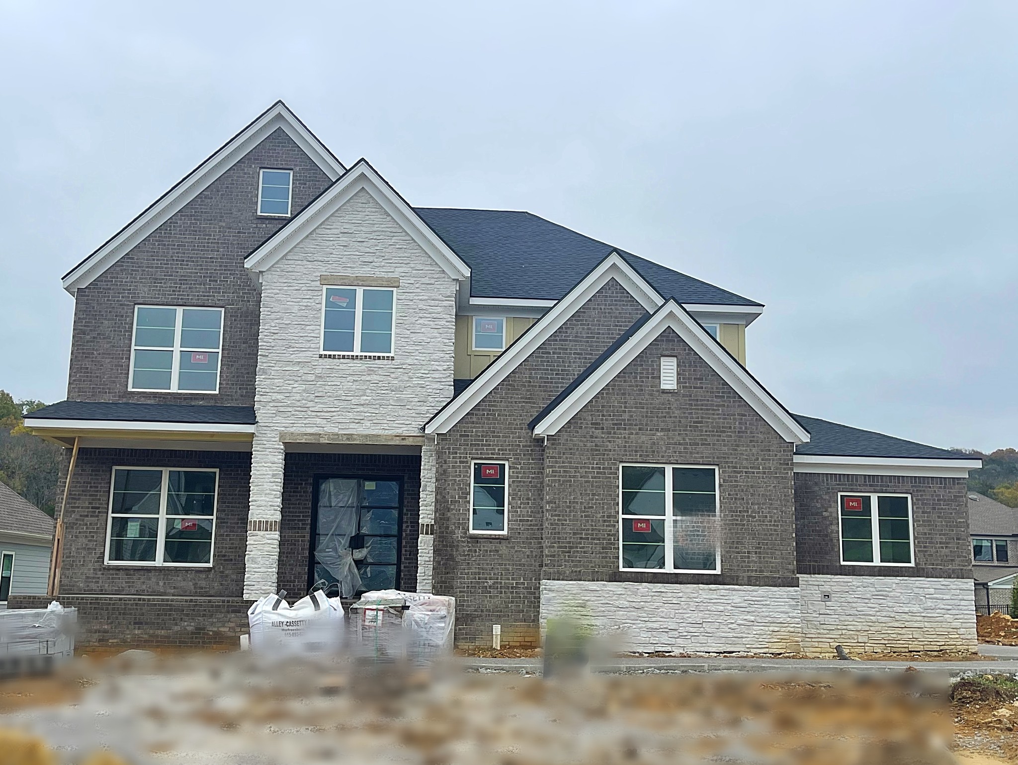 a front view of a house with yard