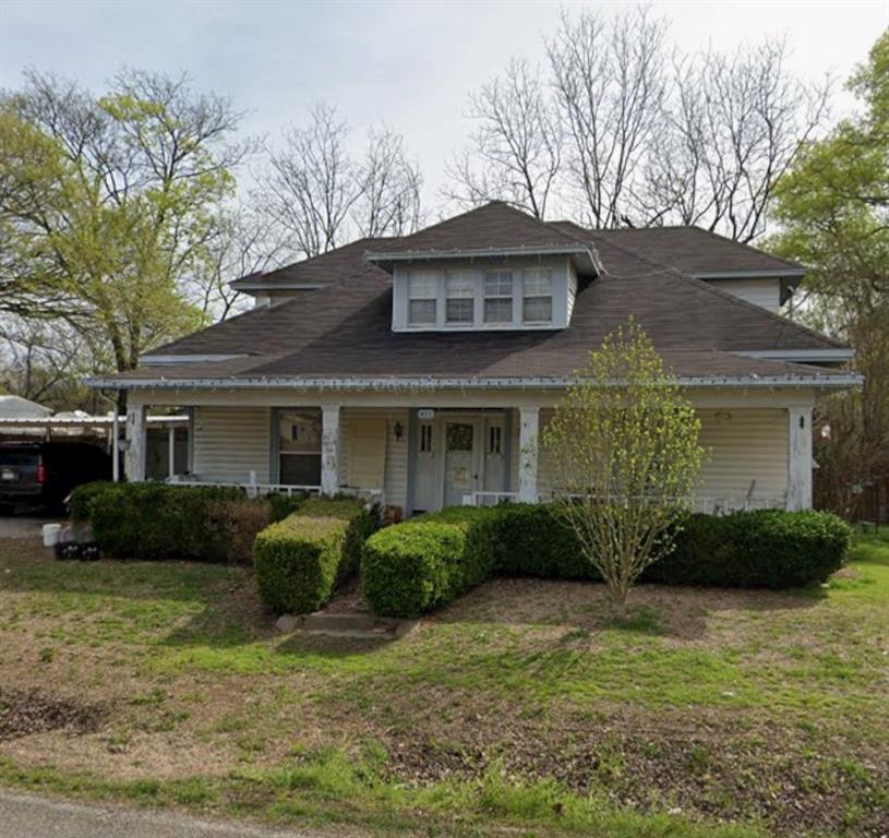 a view of a house with a garden