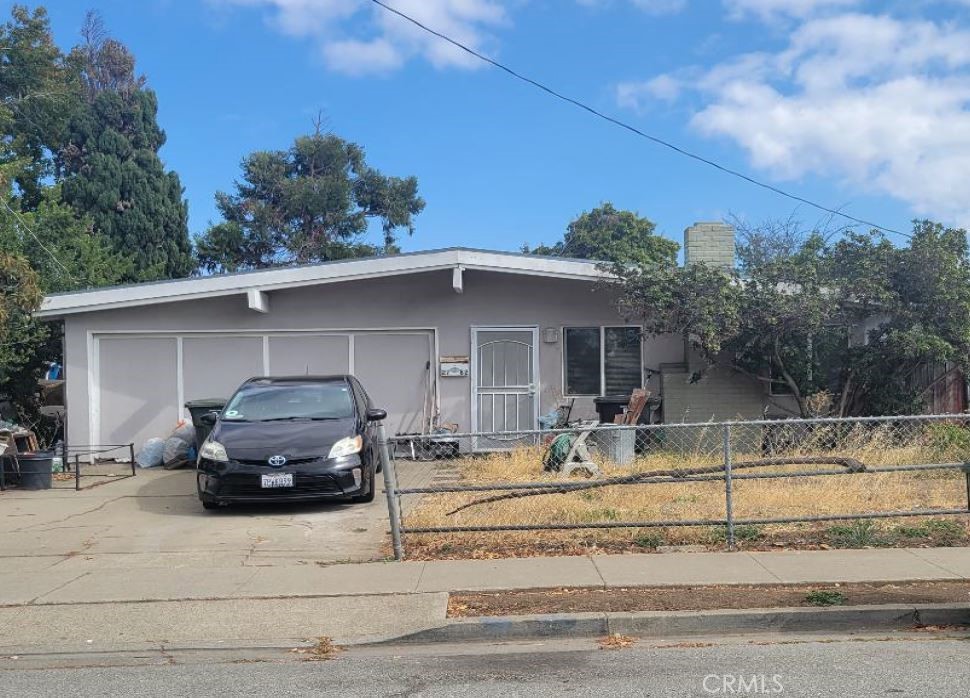 a car parked in front of a house