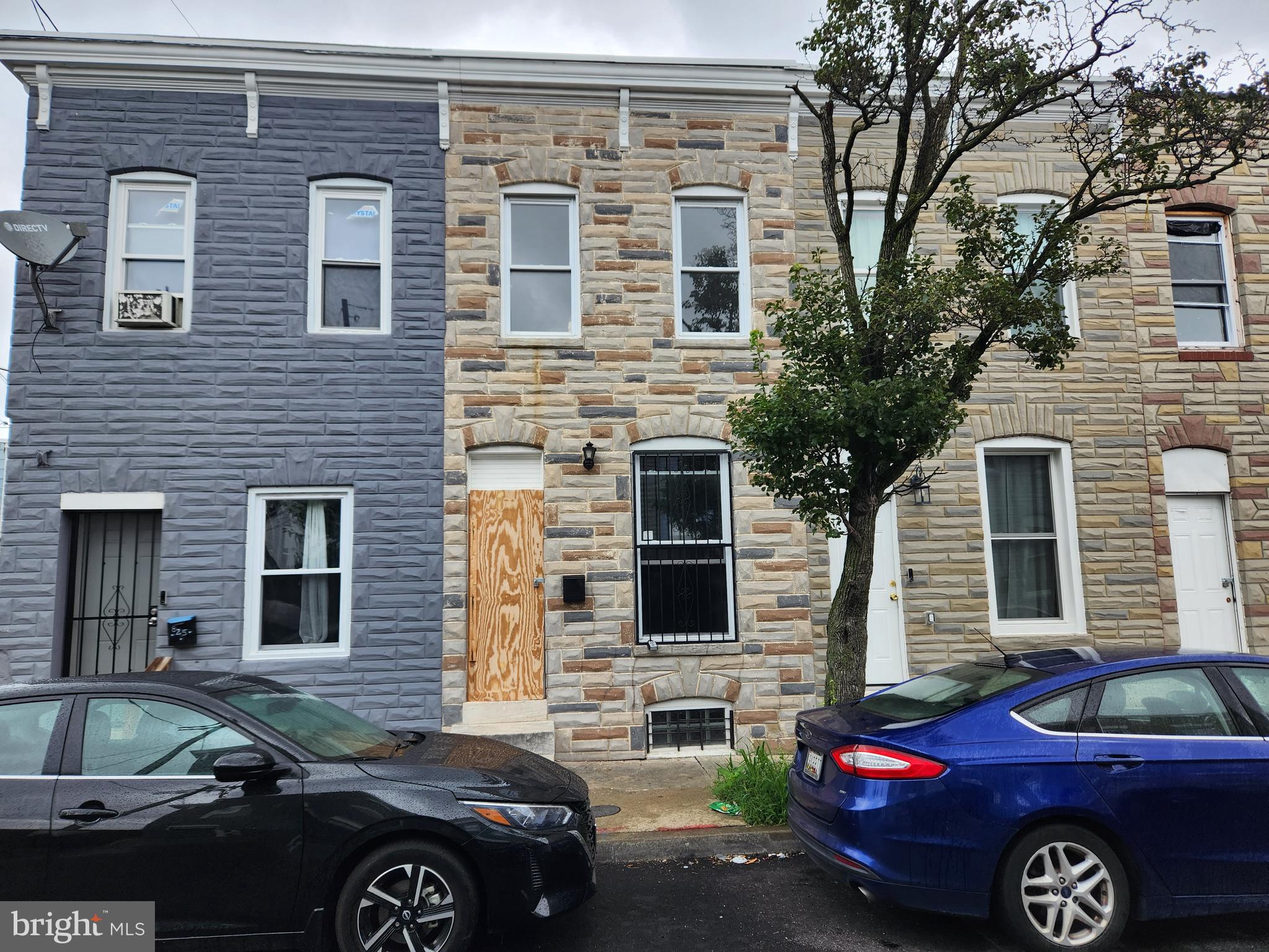 a front view of a house with parking space