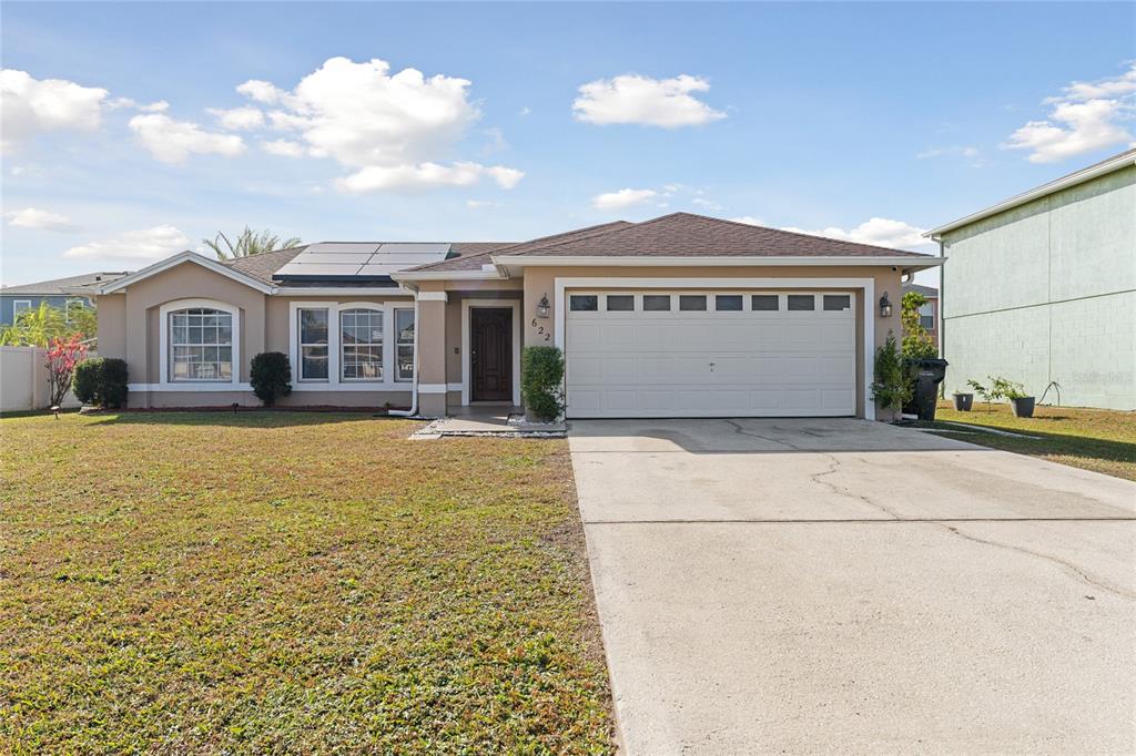 a front view of a house with yard