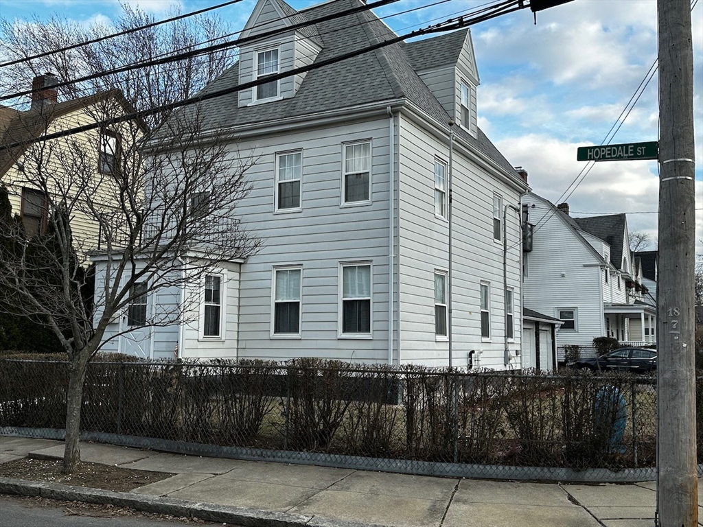 a front view of a house with parking