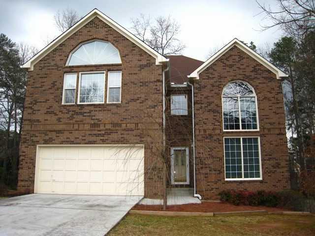 Exterior Front. 4BR/2.5BA, Finished Basement,  Brick and 3-sides Concrete Siding.