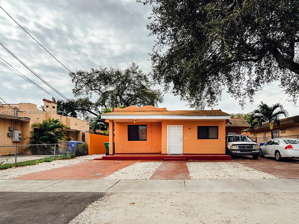 a view of a car park in front of a house