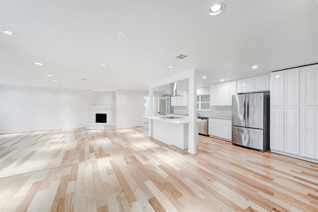 a view of kitchen with wooden floor