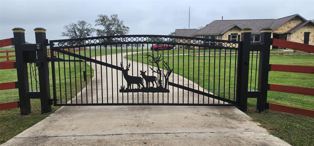 a view of a wrought iron fences in front of house