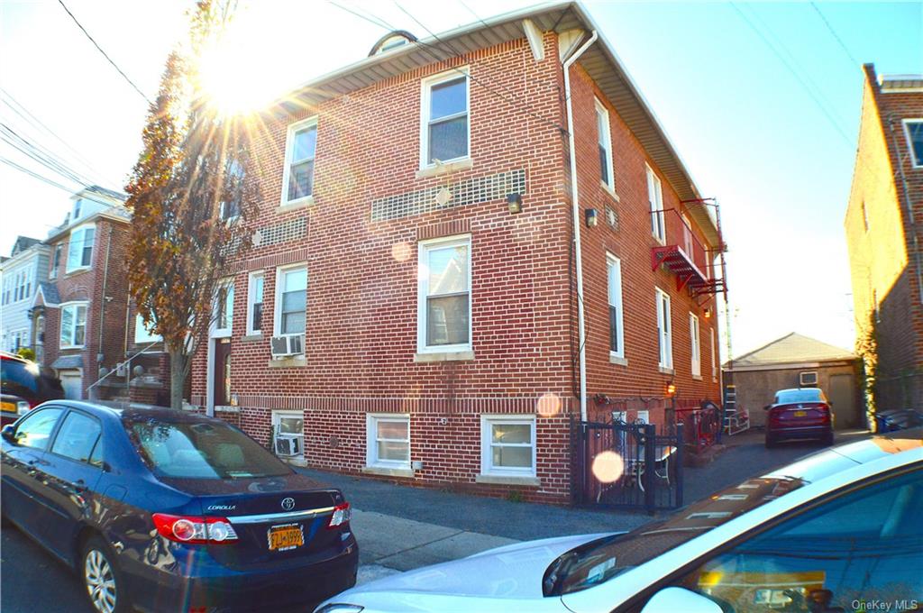 a view of a brick building with many windows