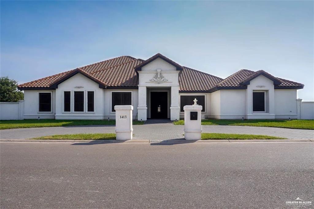 a front view of a house with a outdoor space