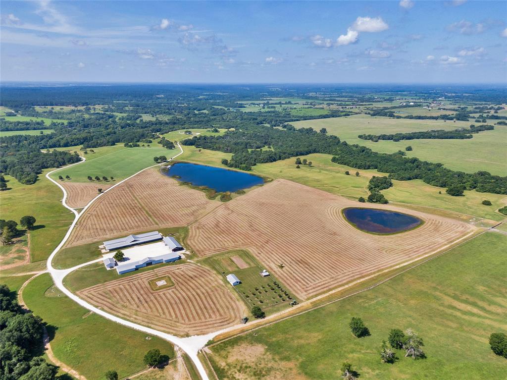 Drone / aerial view featuring a water view and a rural view