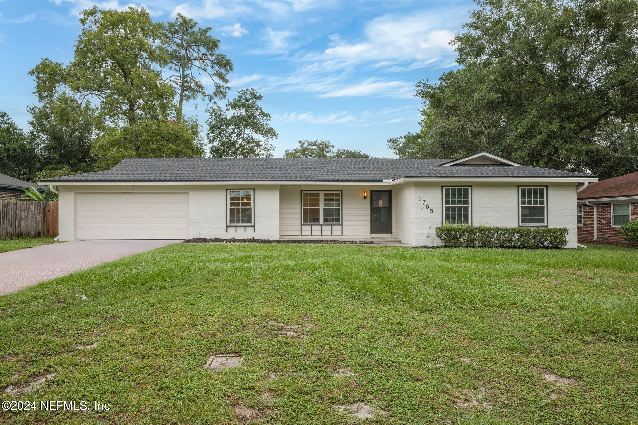 a view of a house with a back yard