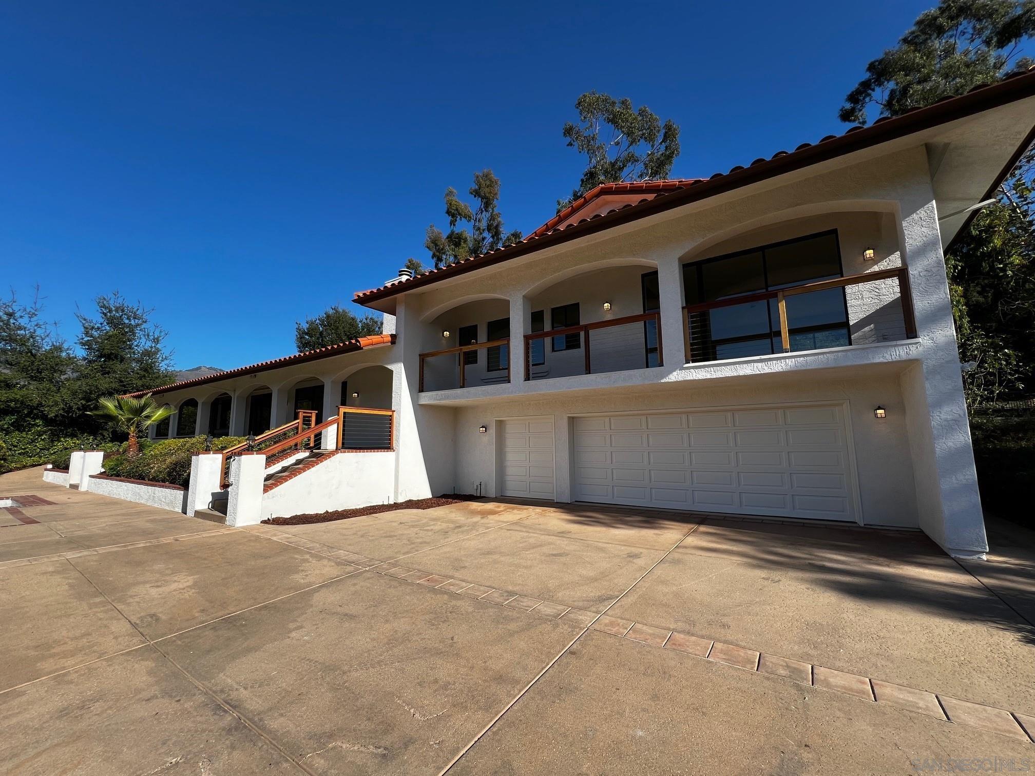 a view of a house with a fence