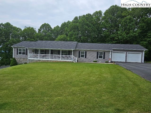 a view of a house with a backyard