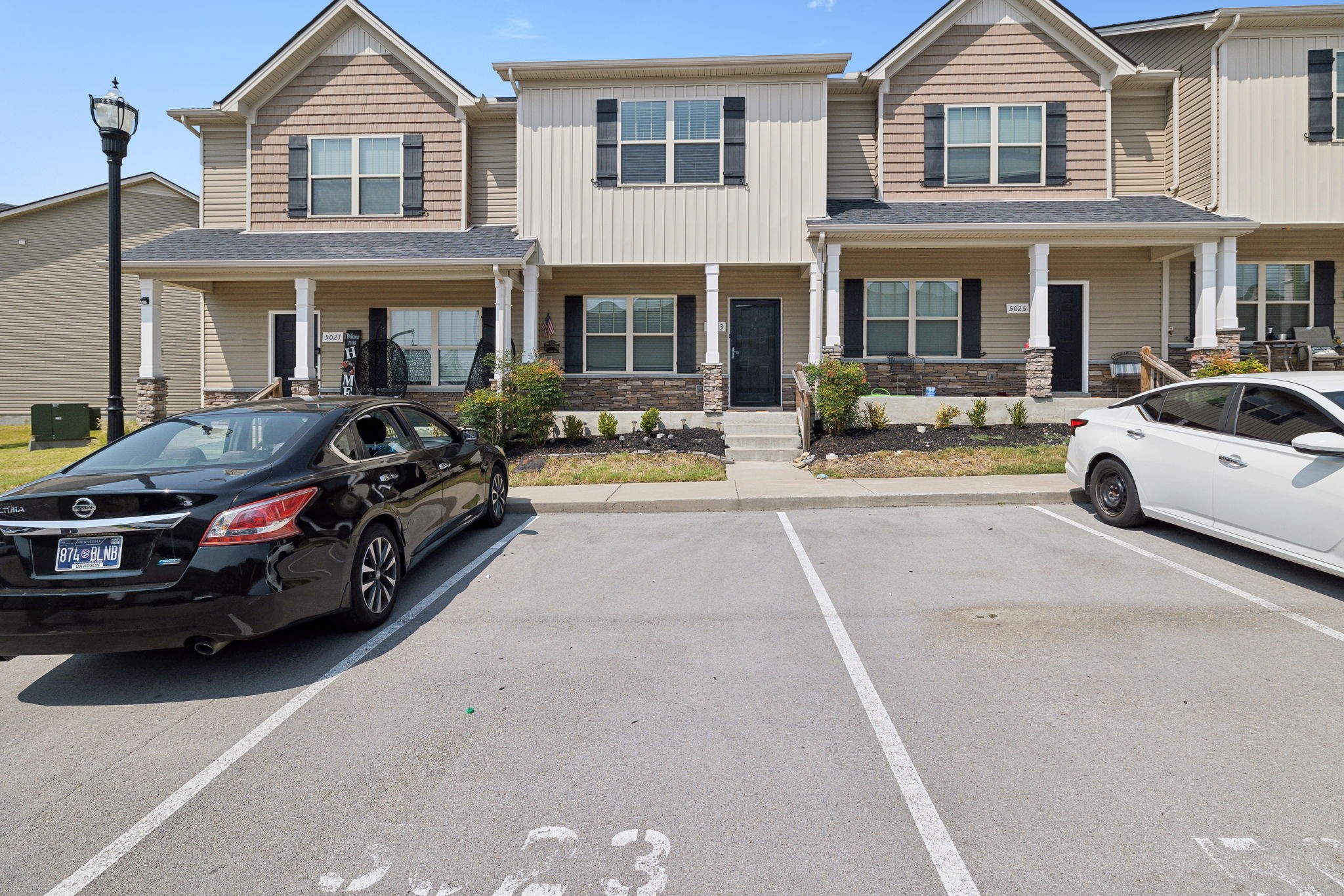 a view of a car parked in front of a house