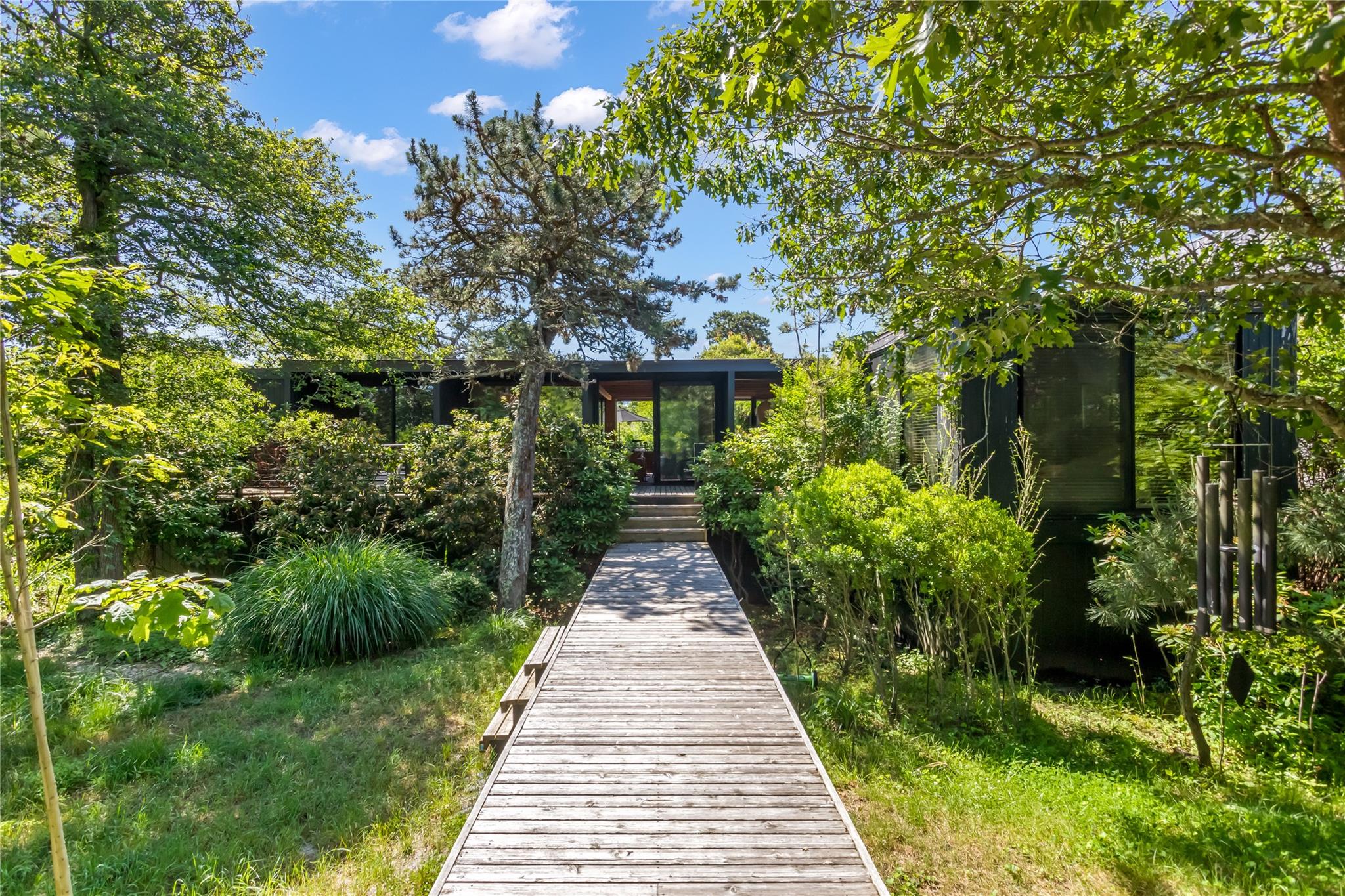 a view of a pathway both side of yard