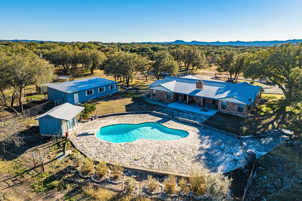 an aerial view of a house with mountain view