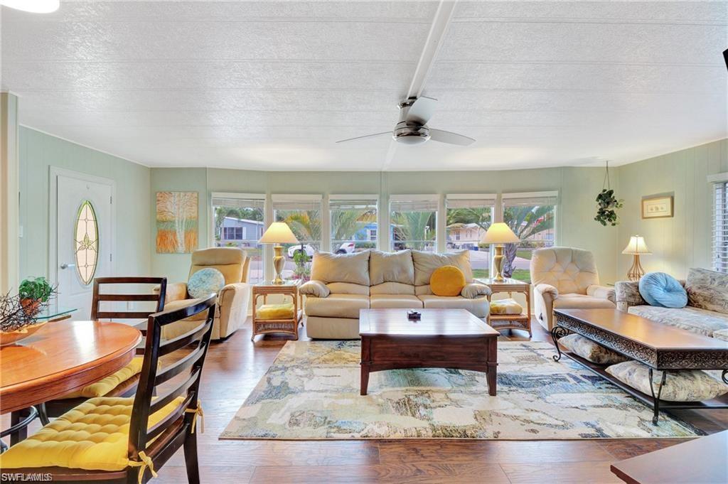 a living room with furniture and a table